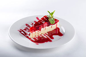 Slice of strawberry cheesecake.